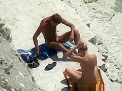 Nude couple secretly filmed in the rocky beach