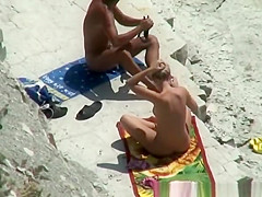 Nude couple secretly filmed in the rocky beach