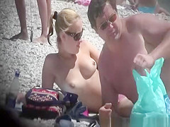 Topless blonde woman at beach