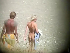 Skinny naked girl at the beach gets spied