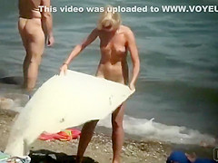 Skinny naked girl at the beach gets spied