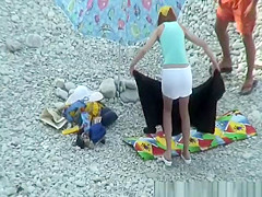 Nudist couple goes take a swim