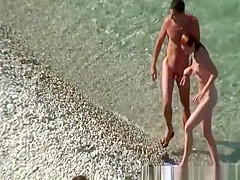 Nudist couple goes take a swim