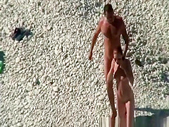 Nudist couple goes take a swim