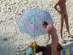 Nudist couple goes take a swim