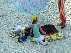 Nudist couple goes take a swim