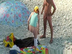 Nudist couple goes take a swim