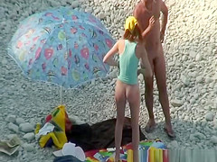 Nudist couple goes take a swim