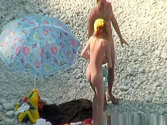 Nudist couple goes take a swim