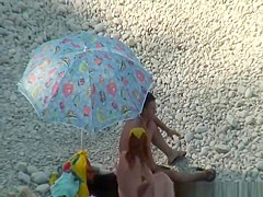 Nudist couple goes take a swim