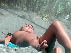 Trimmed pussy nudist caught sunbathing
