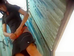 A girl in a flowered bikini .