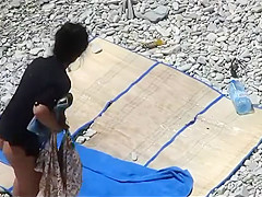 Sexy woman enjoys sunbathing