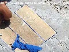 Sexy woman enjoys sunbathing