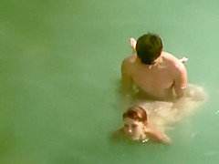 They struggle to fuck in the water