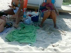 Peeping a big butt in a thong bikini