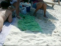 Peeping a big butt in a thong bikini