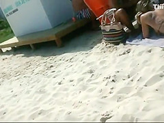 Peeping a big butt in a thong bikini