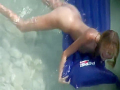 Spread ass of a girl floating in the water
