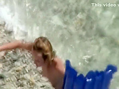 Spread ass of a girl floating in the water