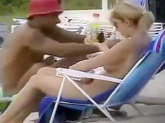 Zooming on a nudist girl's shaved pussy