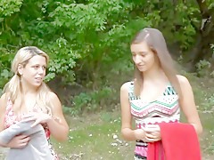 Two girlfriends walking in forest and meeting a guy