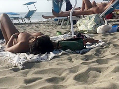 Adorable topless girl with big boobs enjoys the sun