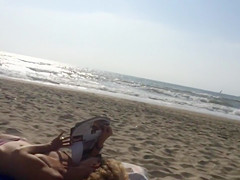 Adorable topless girl with big boobs enjoys the sun
