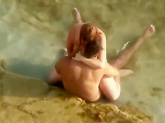 Guy gets an amazing blowjob in the shallow water