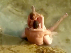 Guy gets an amazing blowjob in the shallow water