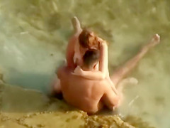 Guy gets an amazing blowjob in the shallow water