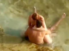 Guy gets an amazing blowjob in the shallow water
