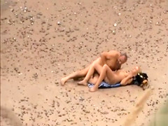 Old daddy tempts the young blonde on a beach