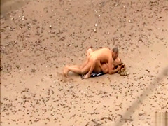 Old daddy tempts the young blonde on a beach
