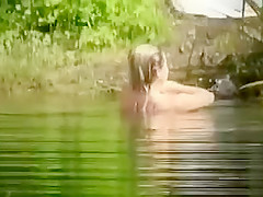 Short-haired GF jumps on a dick while swimming in the lake
