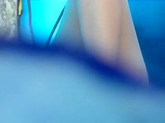 Spying on a nudist girl in a beach tent