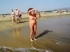My naughty wife takes a naked walk at the coast