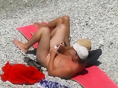 Nude beach relaxation and gentle penis stroking