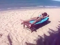 Desirable dish lets her man put sunscreen on her slim body