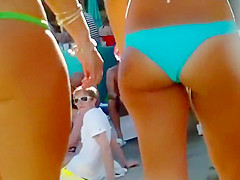 Delightful babes wearing bikinis bounce with their big booties