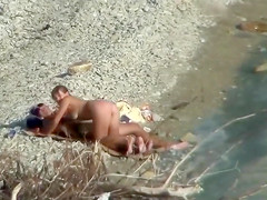 Lazy guy cums into a girlfriend's pussy on the nudist beach