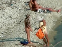 Lazy guy cums into a girlfriend's pussy on the nudist beach