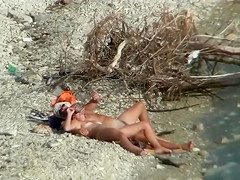Lazy guy cums into a girlfriend's pussy on the nudist beach