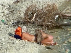 Lazy guy cums into a girlfriend's pussy on the nudist beach