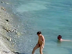 Sensual girl jumps on her boyfriend's fat dick at the nude beach