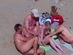Cuckold couple on the beach