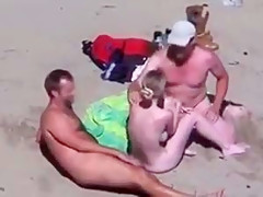 Cuckold couple on the beach