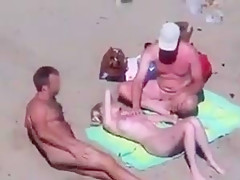Cuckold couple on the beach