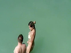 Adorable woman has steaming hot sex in the water