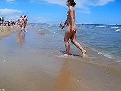 Older people walk around the beach completely naked